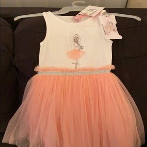 White, pink and orange blush dress.